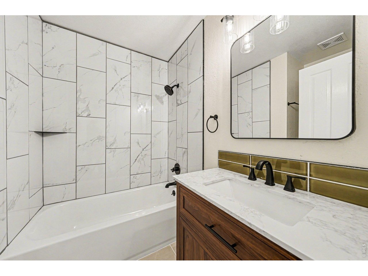 915 Pear Street Fort Collins, CO 80521 - Photo 15 of 20 a bathroom with a sink and a mirror