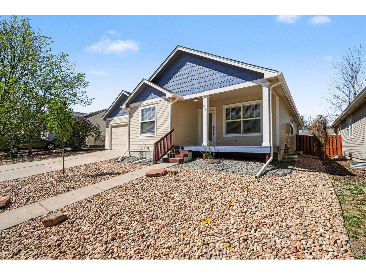 915 Pear Street Fort Collins, CO 80521 - Photo 2 of 20 a view of a house with a yard