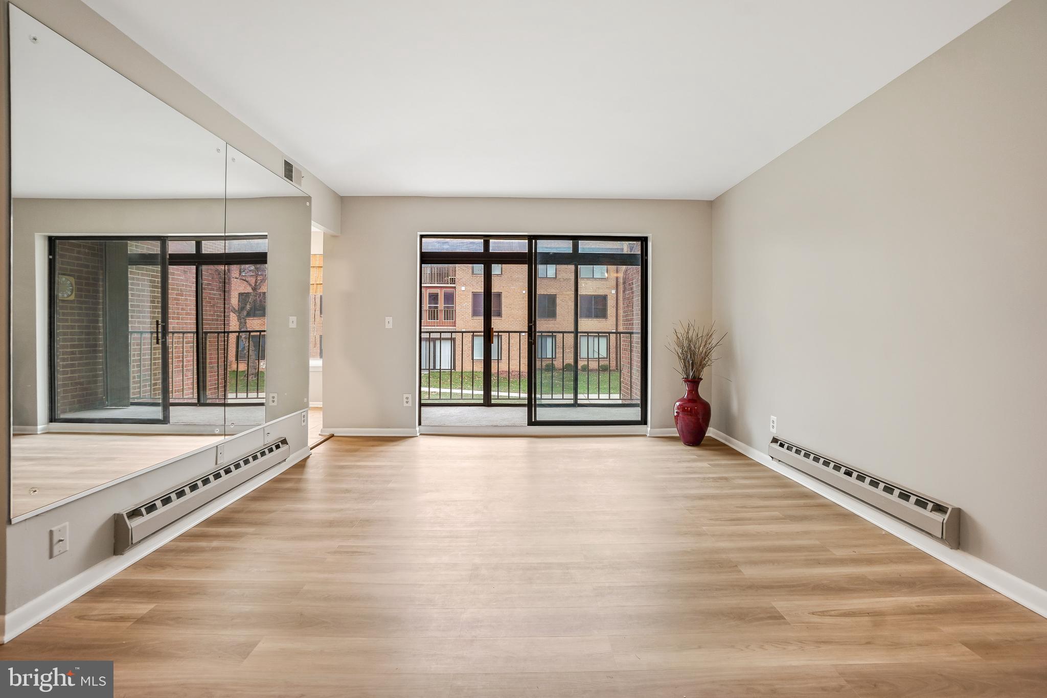 15301 Beaverbrook Court, Unit 922B Silver Spring, MD 20906 - Photo 2 of 47 Living Room/Sliding Glass Door to Enclosed Balcony