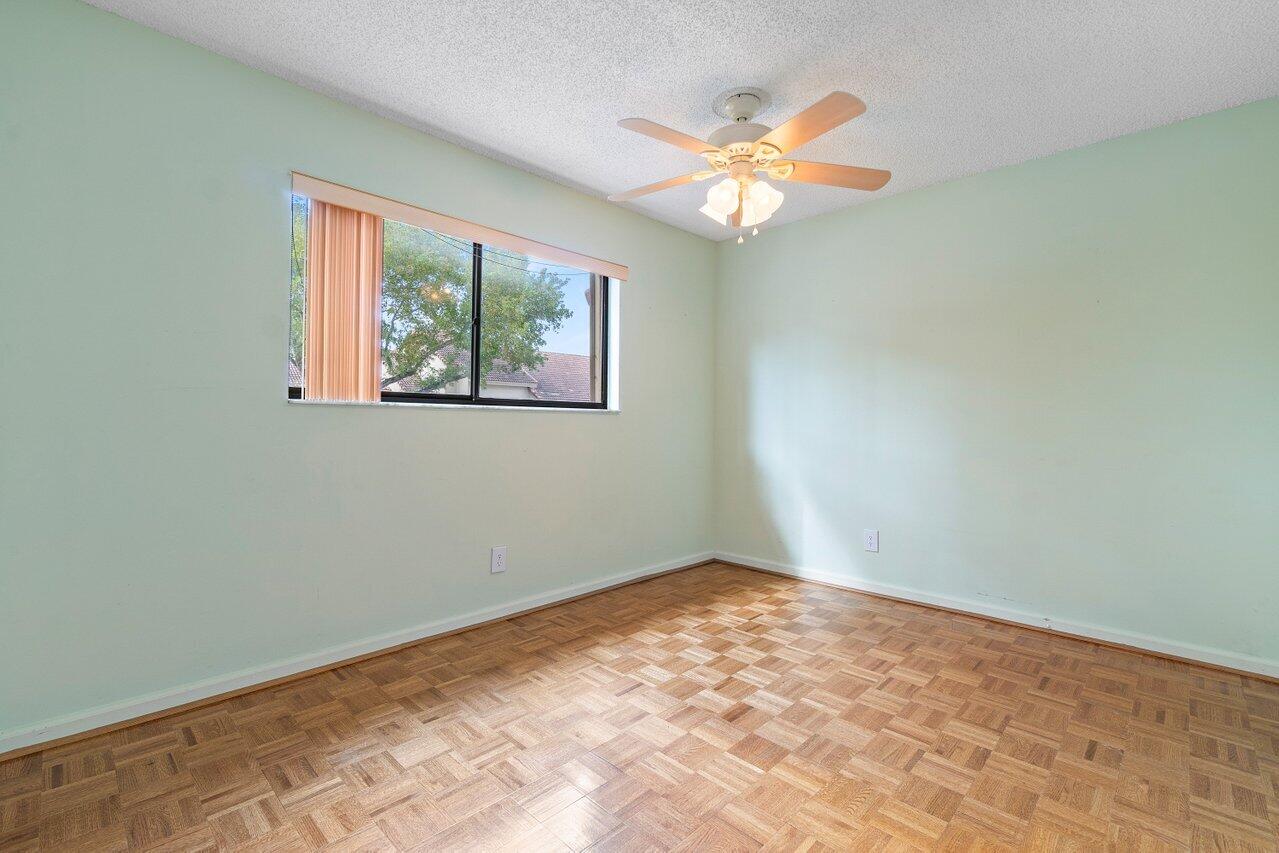 5630 Coach House Circle, Unit F Boca Raton, FL 33486 - Photo 22 of 34 SUNNY AND BRIGHT GUEST BEDROOM