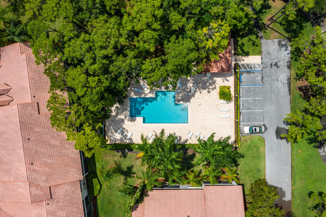 5630 Coach House Circle, Unit F Boca Raton, FL 33486 - Photo 26 of 34 ONE OF TWO HEATED POOLS