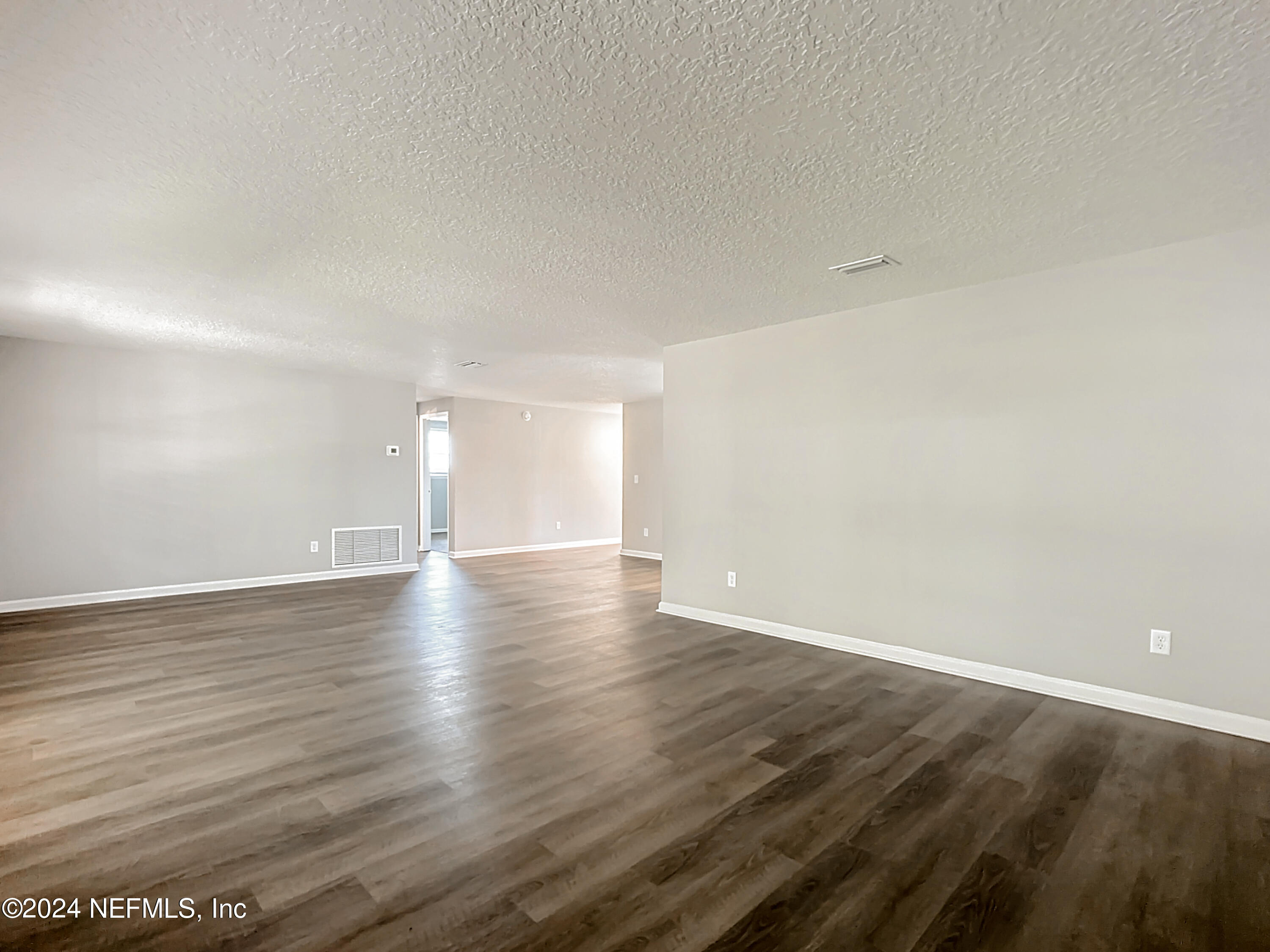 242 Shores Boulevard St. Augustine, FL 32086 - Photo 12 of 42 a view of a room with wooden floor and window