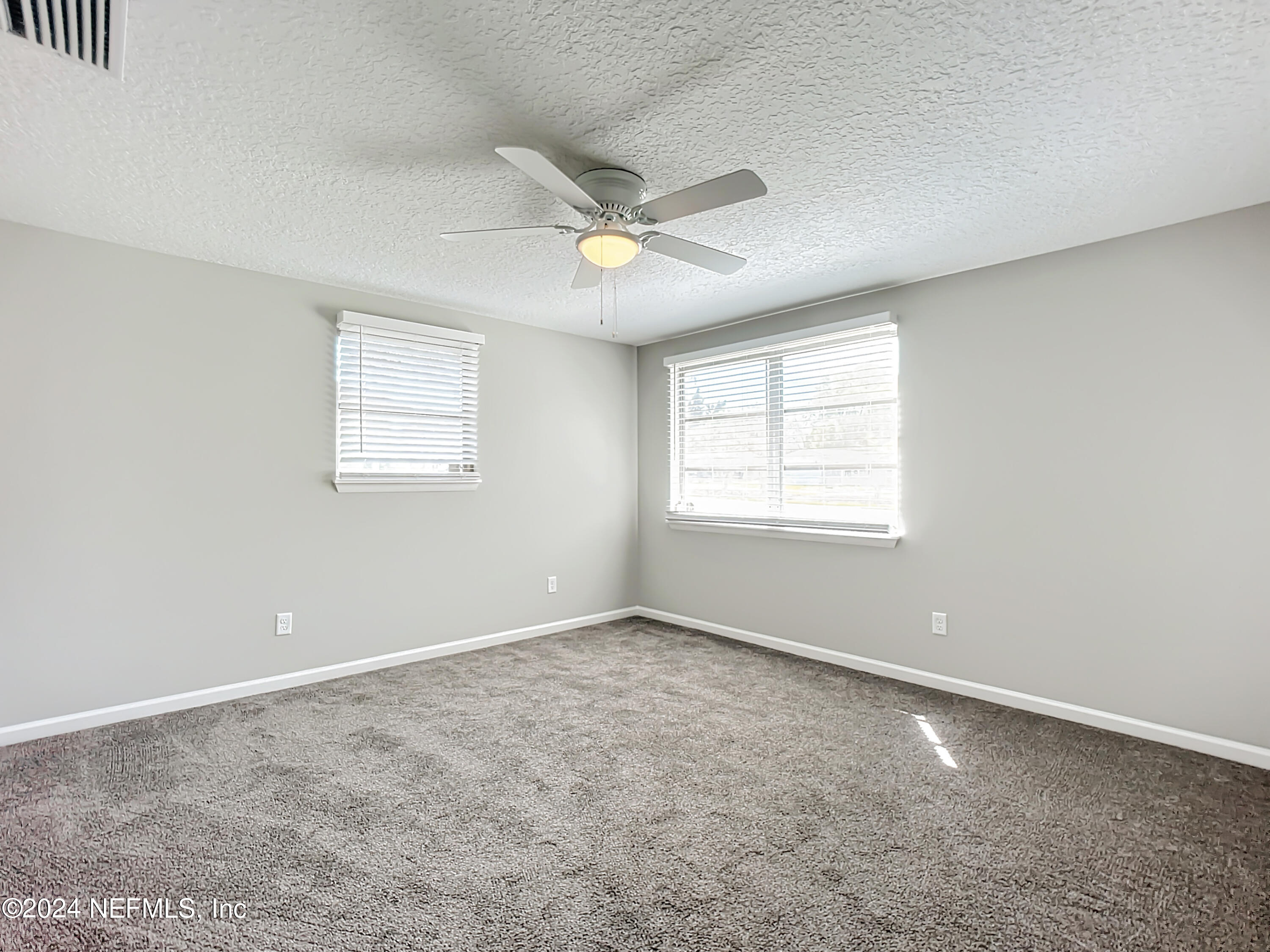 242 Shores Boulevard St. Augustine, FL 32086 - Photo 16 of 42 a view of an empty room with a window