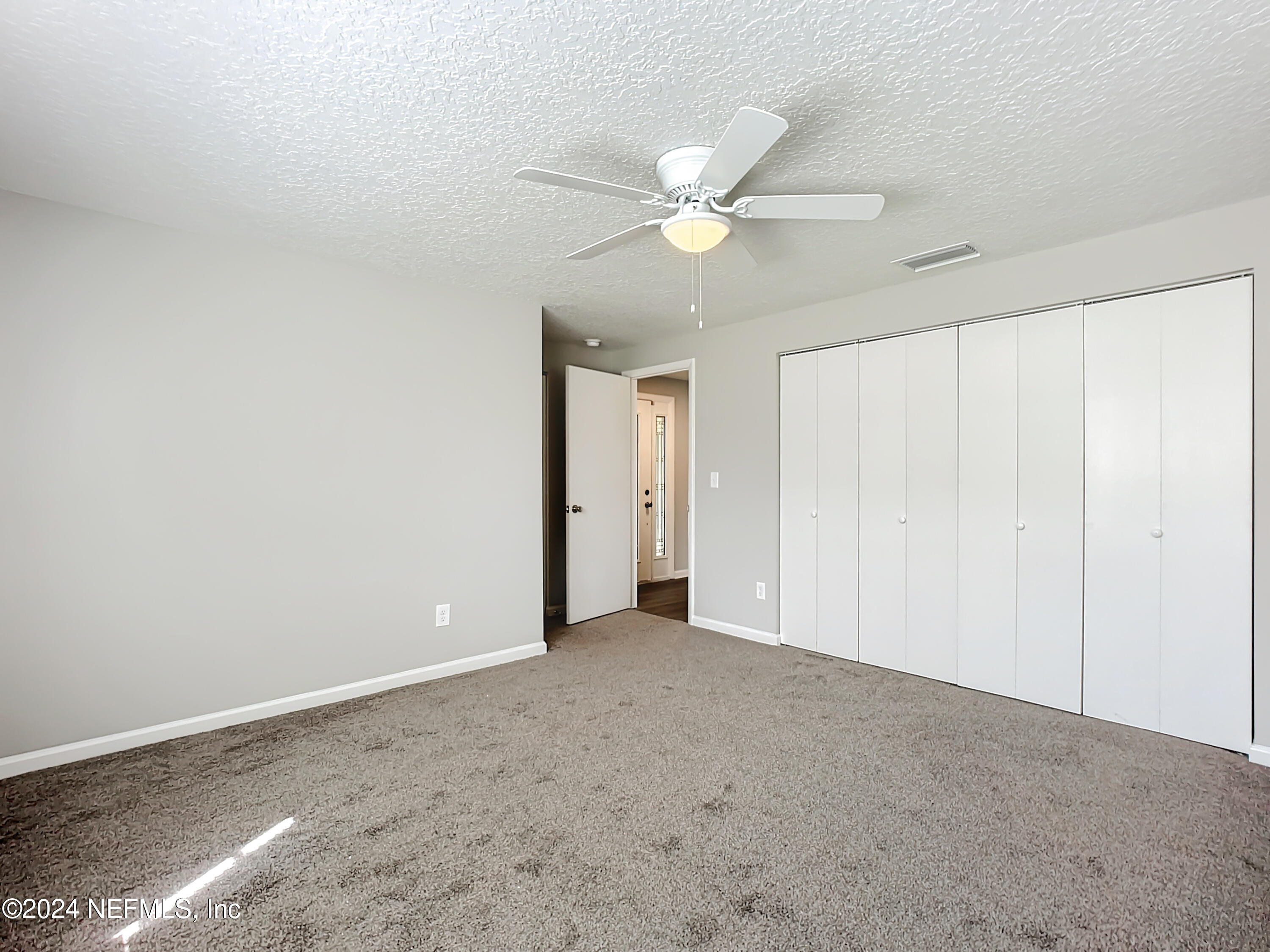 242 Shores Boulevard St. Augustine, FL 32086 - Photo 17 of 42 a view of an empty room with a window