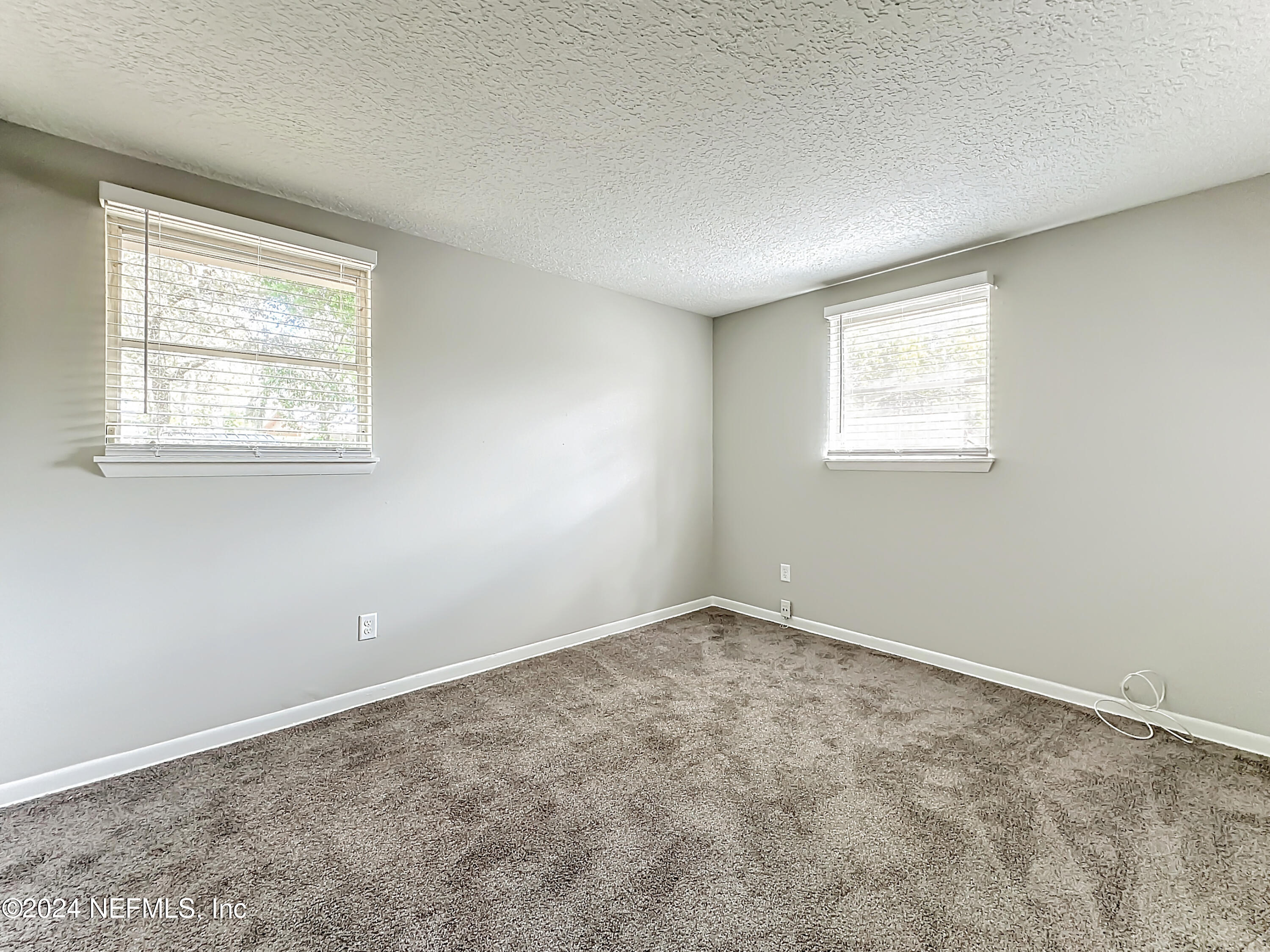 242 Shores Boulevard St. Augustine, FL 32086 - Photo 20 of 42 an empty room with a window