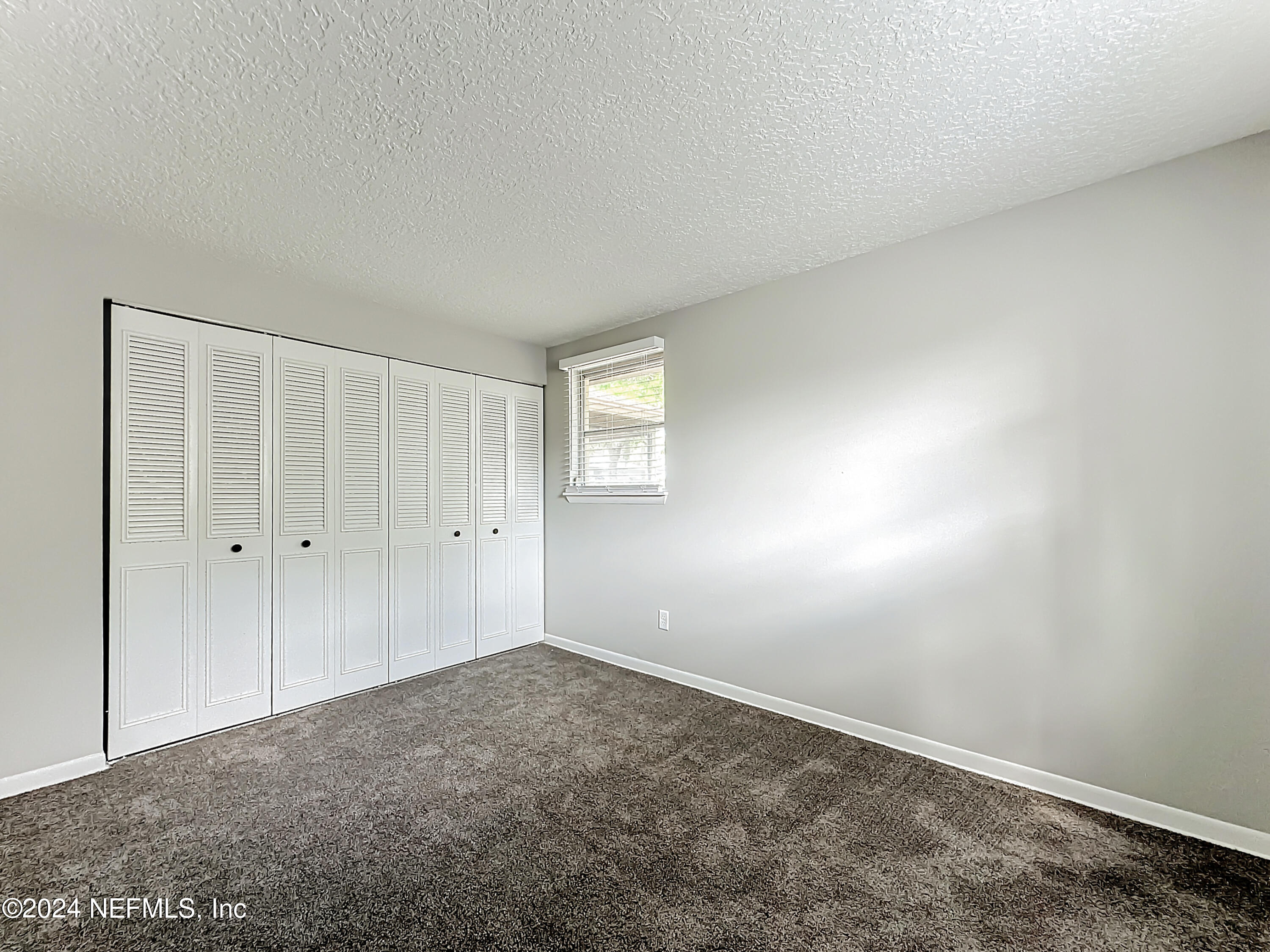 242 Shores Boulevard St. Augustine, FL 32086 - Photo 23 of 42 a view of an empty room and closet area
