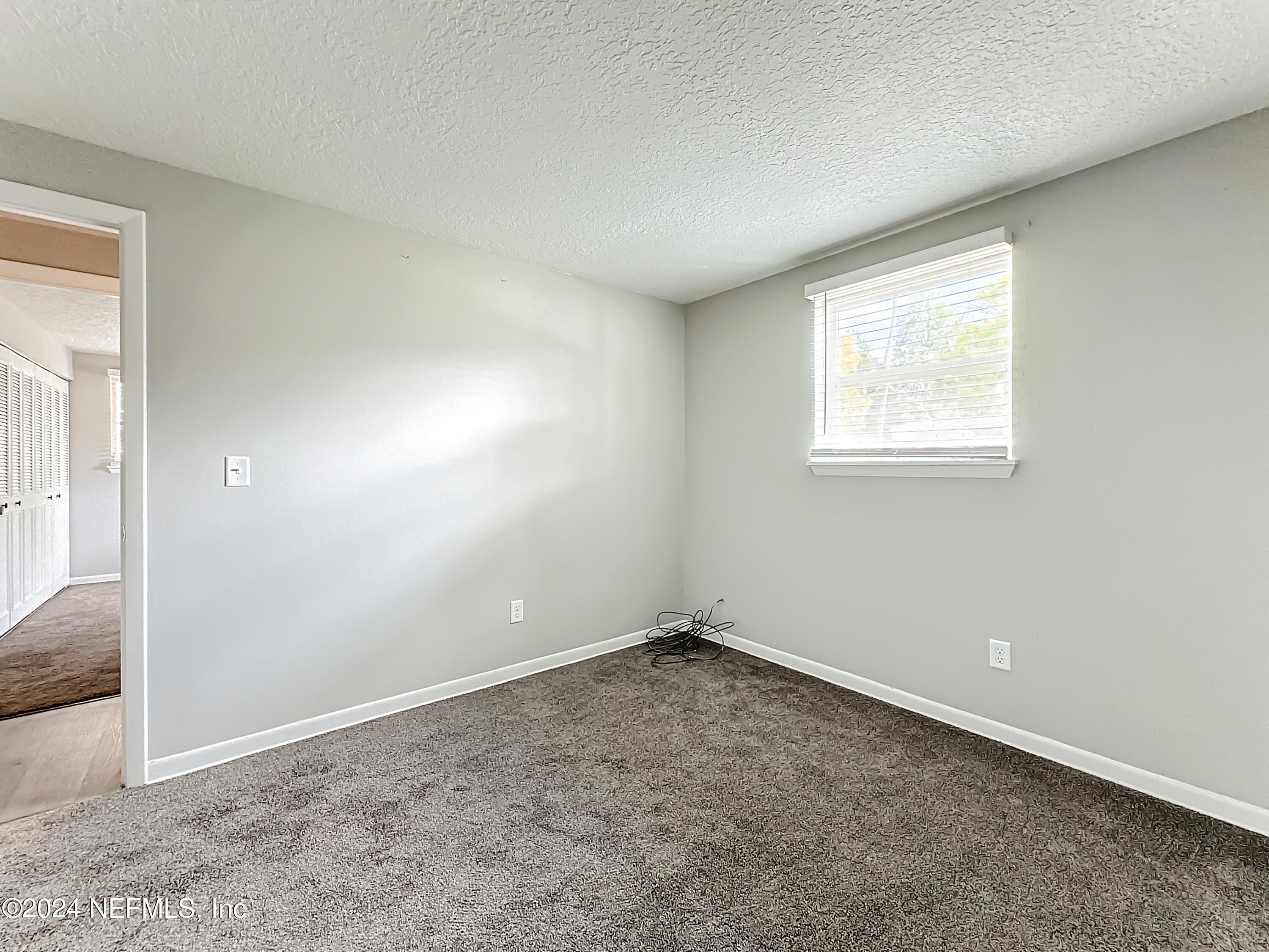 242 Shores Boulevard St. Augustine, FL 32086 - Photo 27 of 42 an empty room with a window