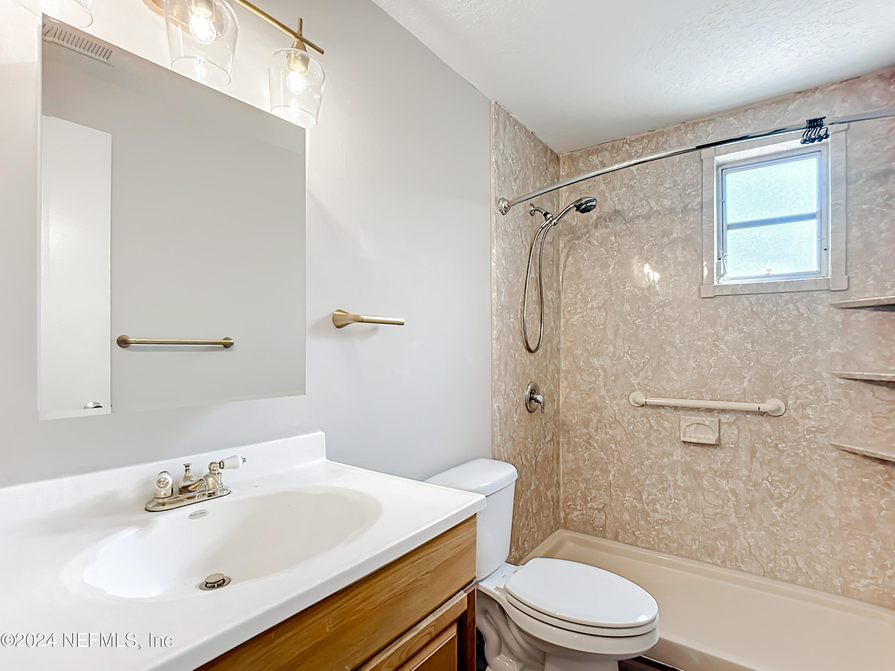 242 Shores Boulevard St. Augustine, FL 32086 - Photo 28 of 42 a bathroom with a sink toilet and shower