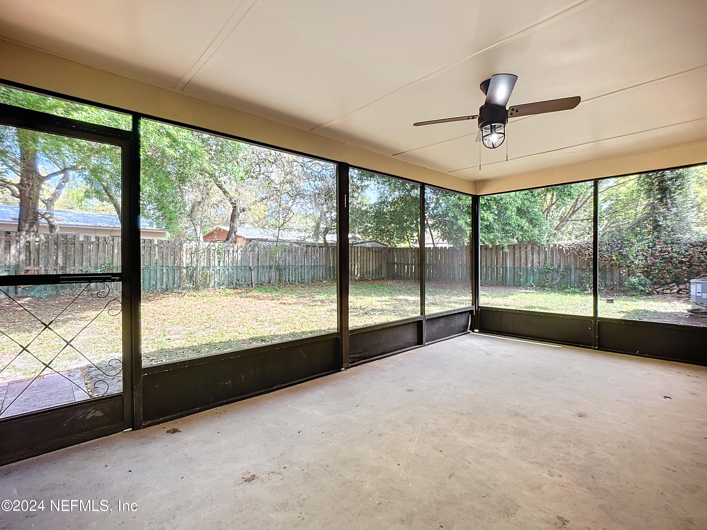 242 Shores Boulevard St. Augustine, FL 32086 - Photo 34 of 42 a view of an empty room with a large window with front door