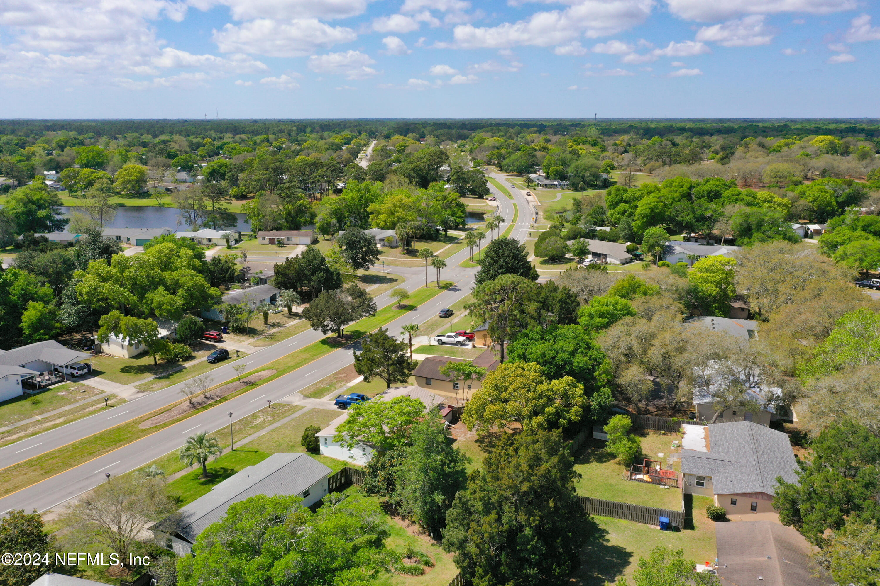 242 Shores Boulevard St. Augustine, FL 32086 - Photo 41 of 42 an aerial view of residential houses with outdoor space and a lake view