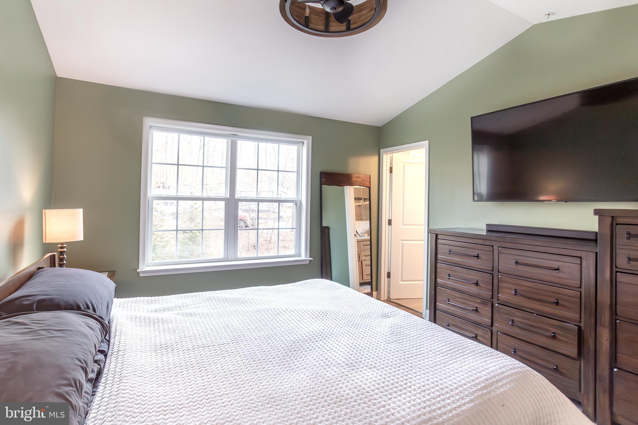 1362 Rock Ridge Road Jarrettsville, MD 21084 - Photo 24 of 50 a bedroom with a bed and a flat screen tv