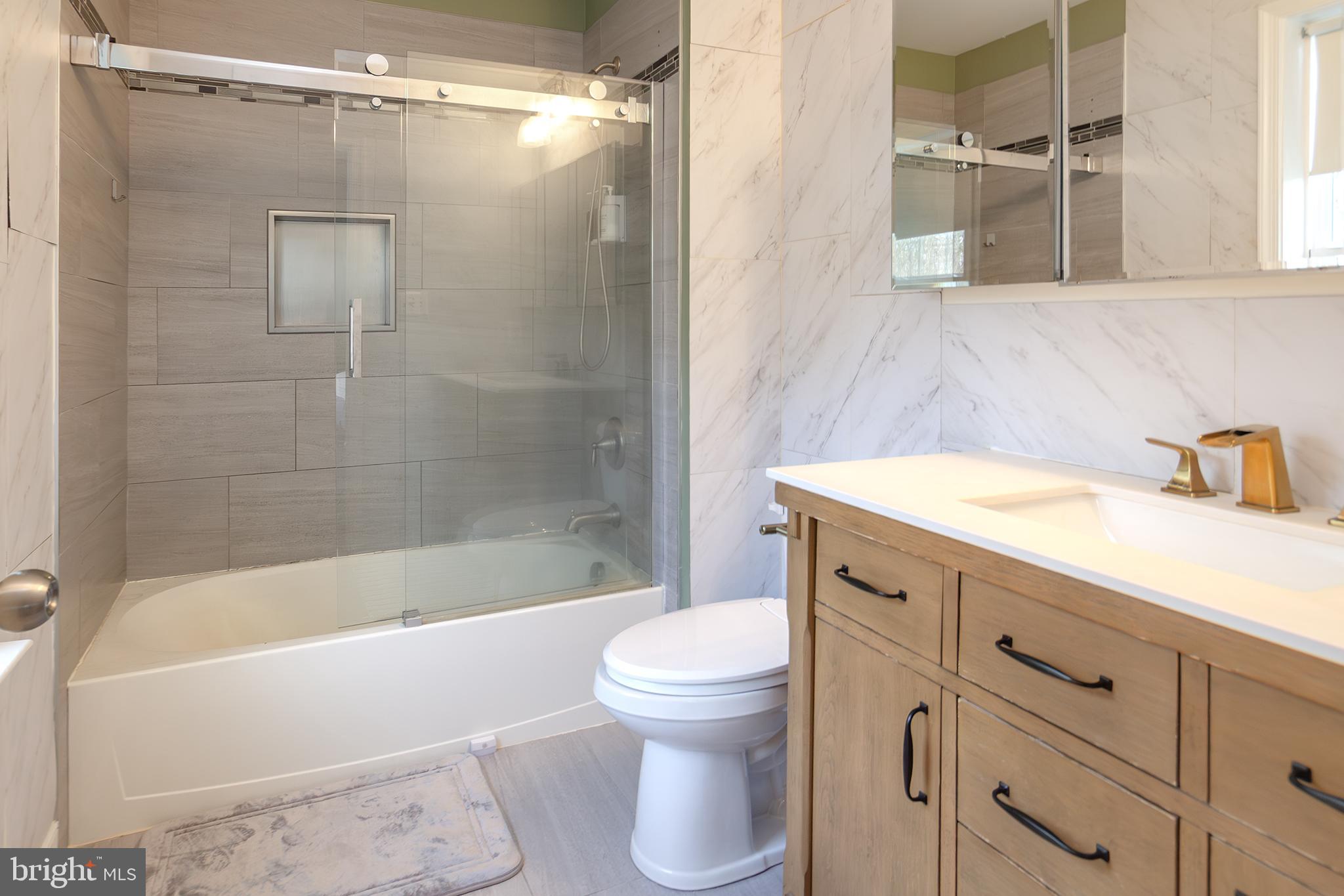 1362 Rock Ridge Road Jarrettsville, MD 21084 - Photo 25 of 50 a bathroom with a sink toilet and shower