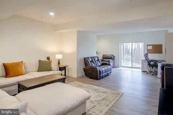 a living room with furniture and a rug