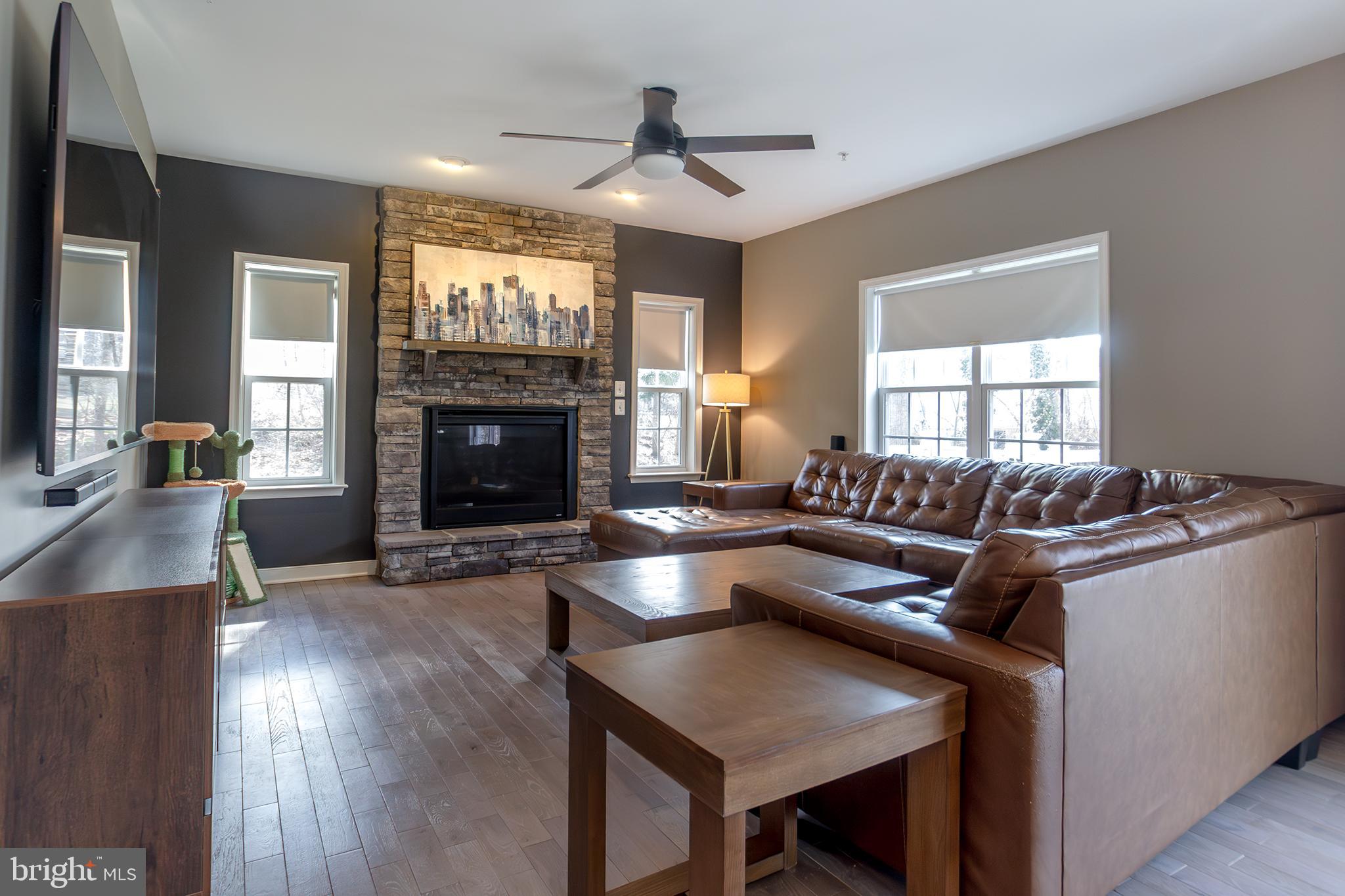 1362 Rock Ridge Road Jarrettsville, MD 21084 - Photo 7 of 50 a living room with furniture and a fireplace