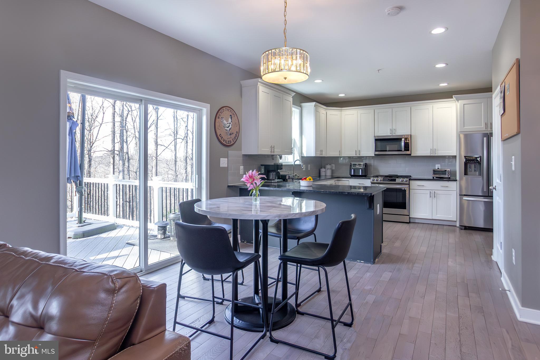 1362 Rock Ridge Road Jarrettsville, MD 21084 - Photo 10 of 50 a view of a dining room with furniture window and wooden floor