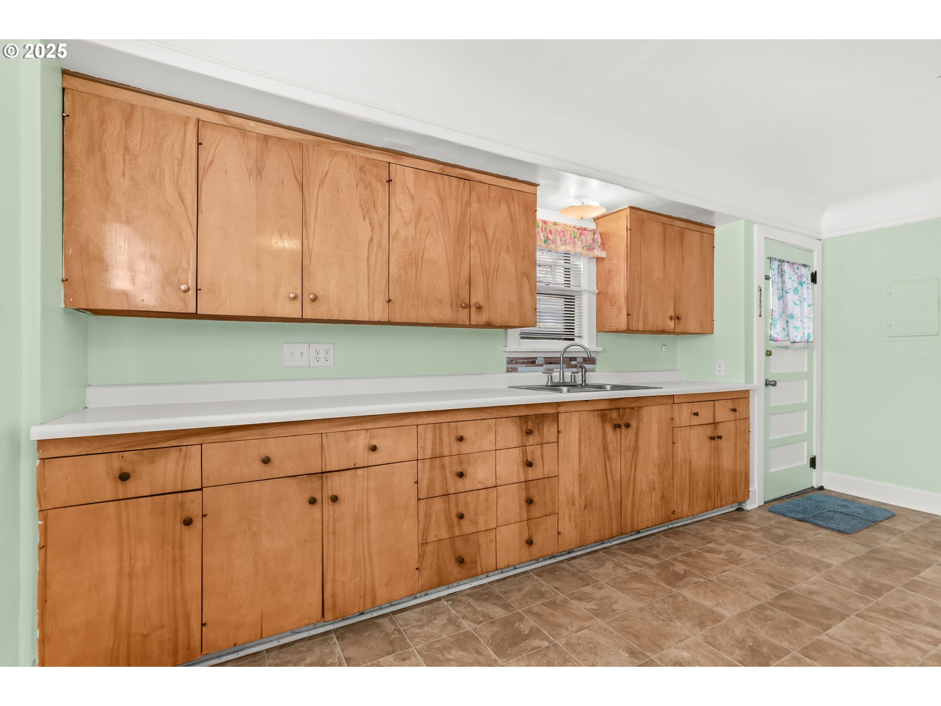 8233 Northeast Tillamook Street Portland, OR 97220 - Photo 14 of 46 a kitchen with granite countertop wooden cabinets