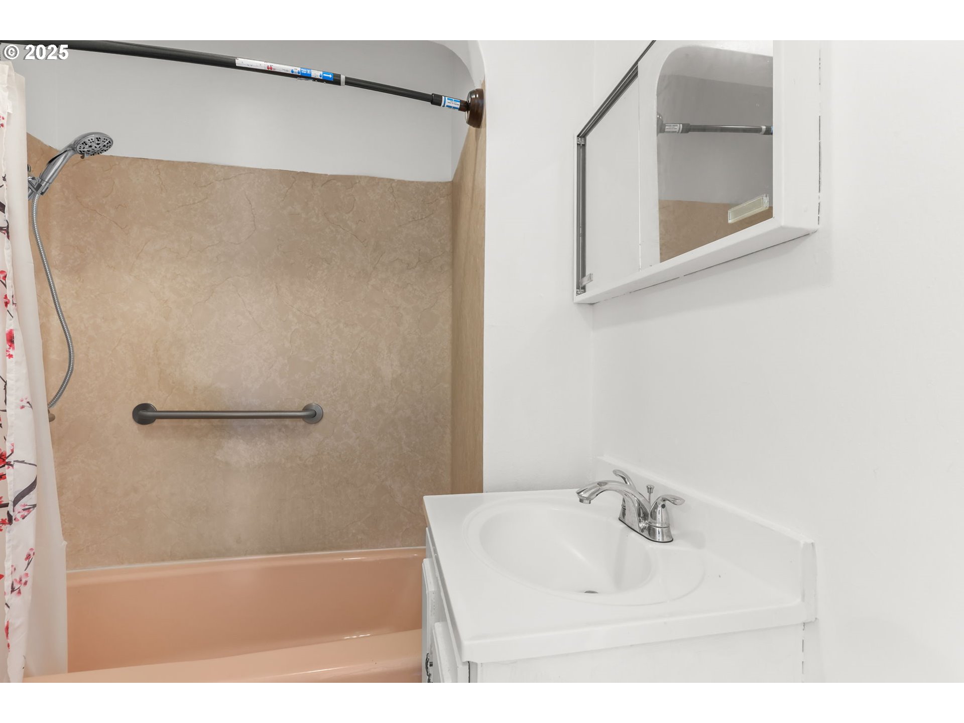 8233 Northeast Tillamook Street Portland, OR 97220 - Photo 22 of 46 a bathroom with a sink and a mirror