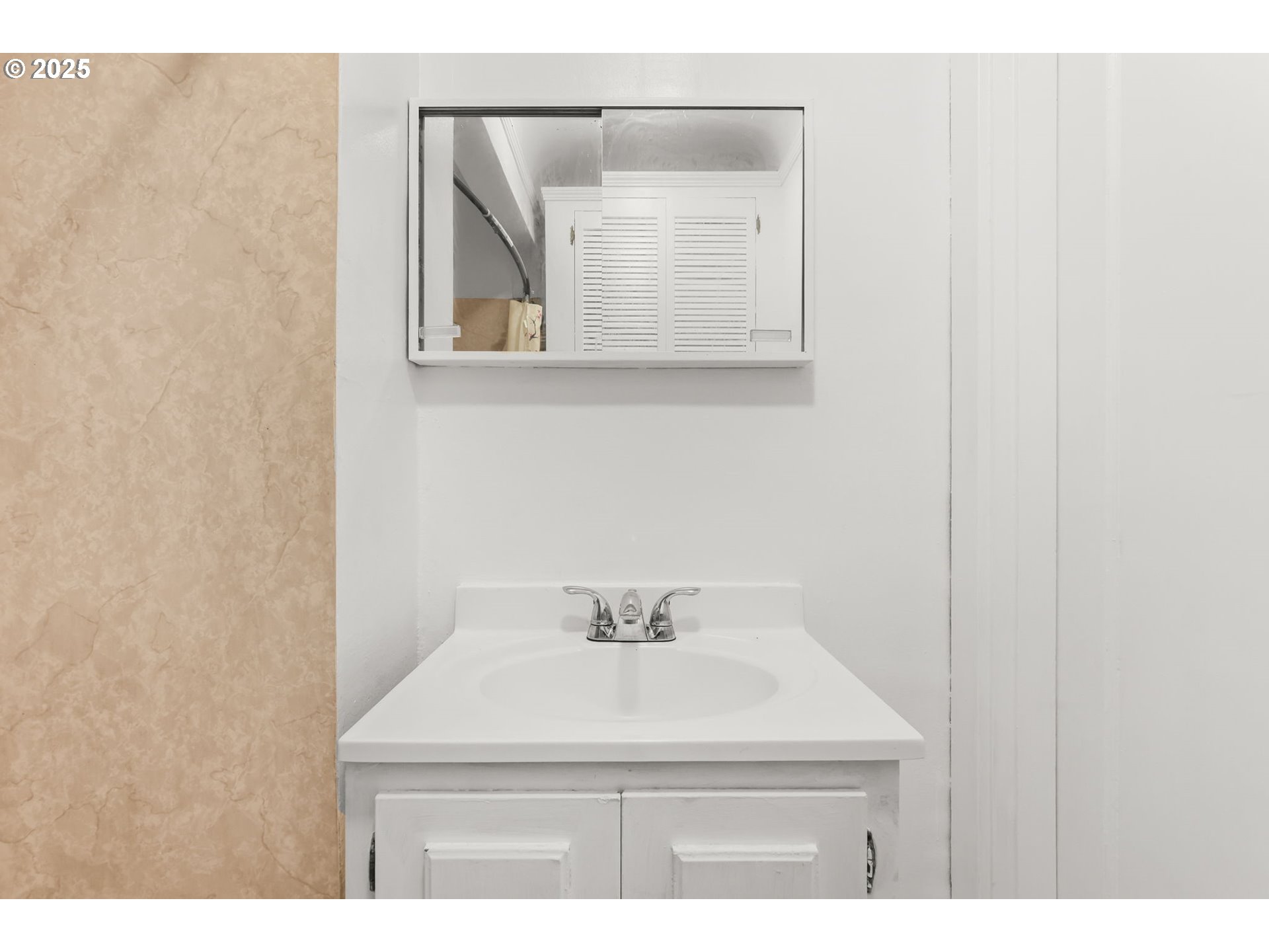 8233 Northeast Tillamook Street Portland, OR 97220 - Photo 24 of 46 a bathroom with a sink and a mirror