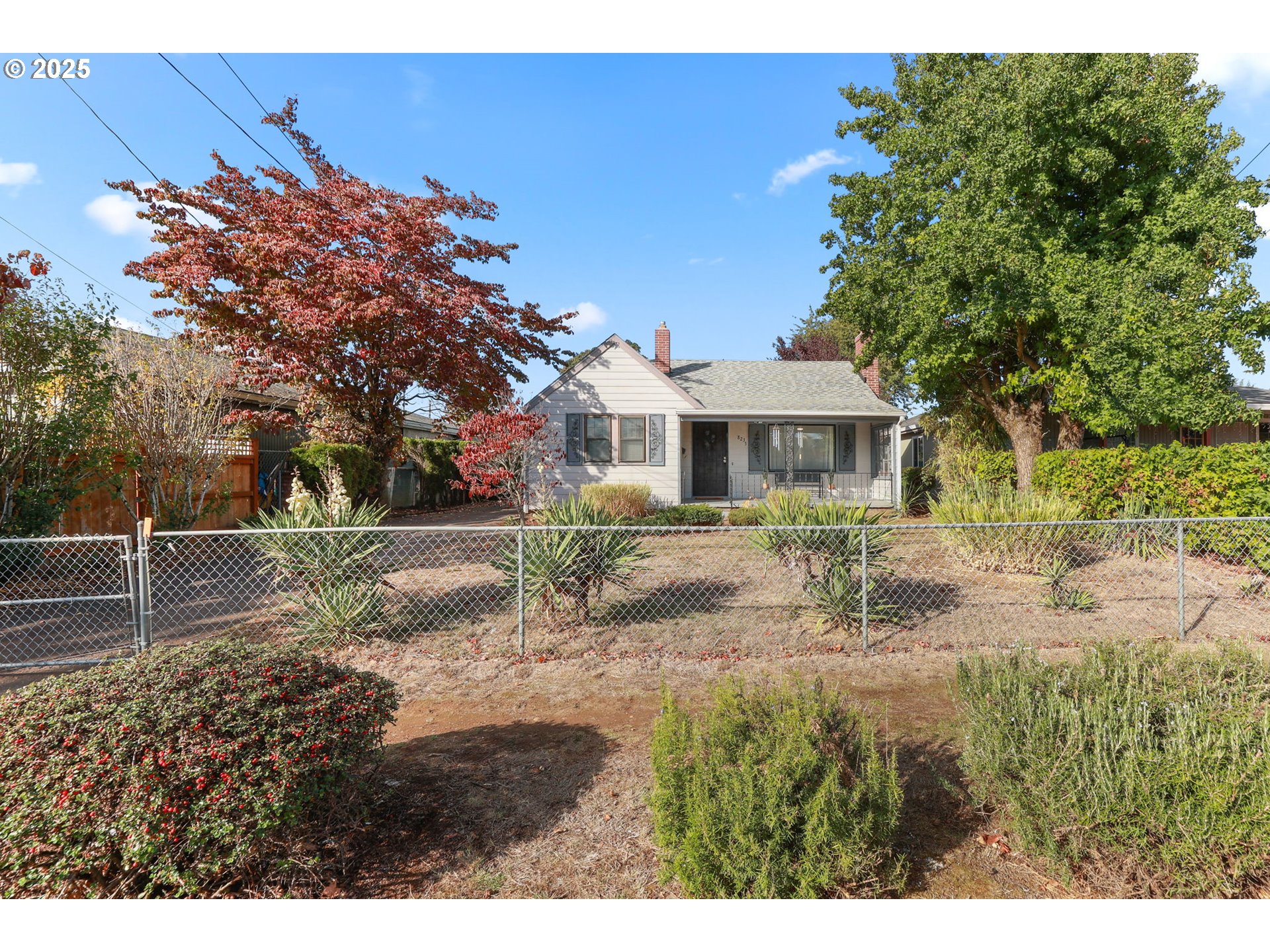 8233 Northeast Tillamook Street Portland, OR 97220 - Photo 3 of 46 a front view of a house with a yard