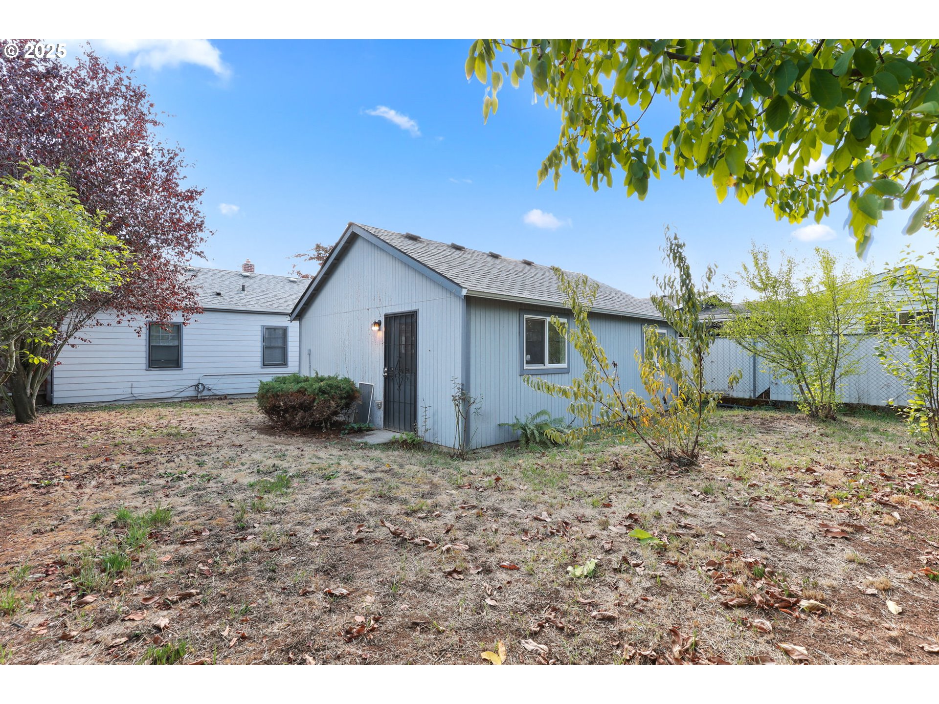 8233 Northeast Tillamook Street Portland, OR 97220 - Photo 32 of 46 a view of a house with a yard