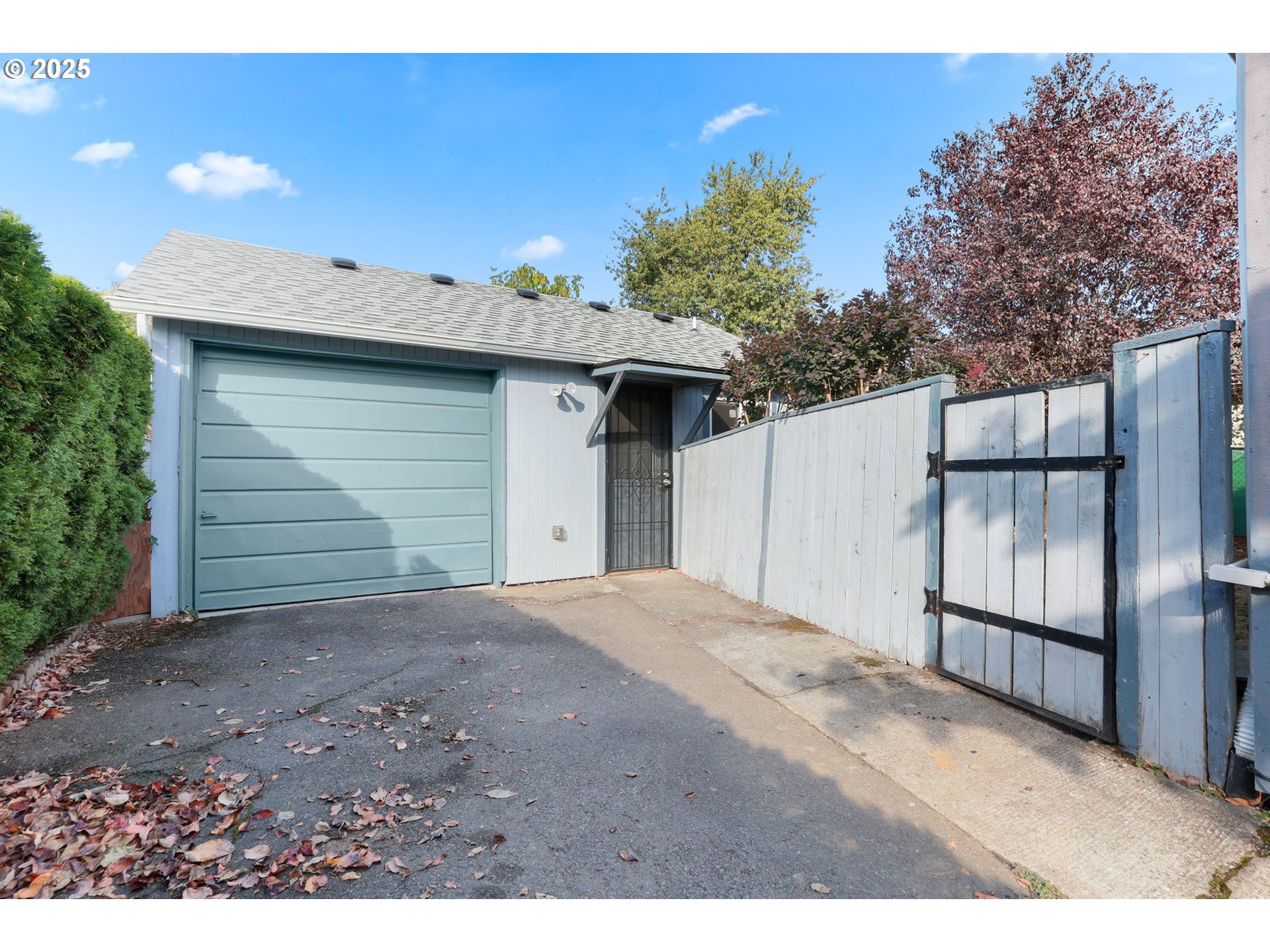 8233 Northeast Tillamook Street Portland, OR 97220 - Photo 35 of 46 a front view of a house with a garage