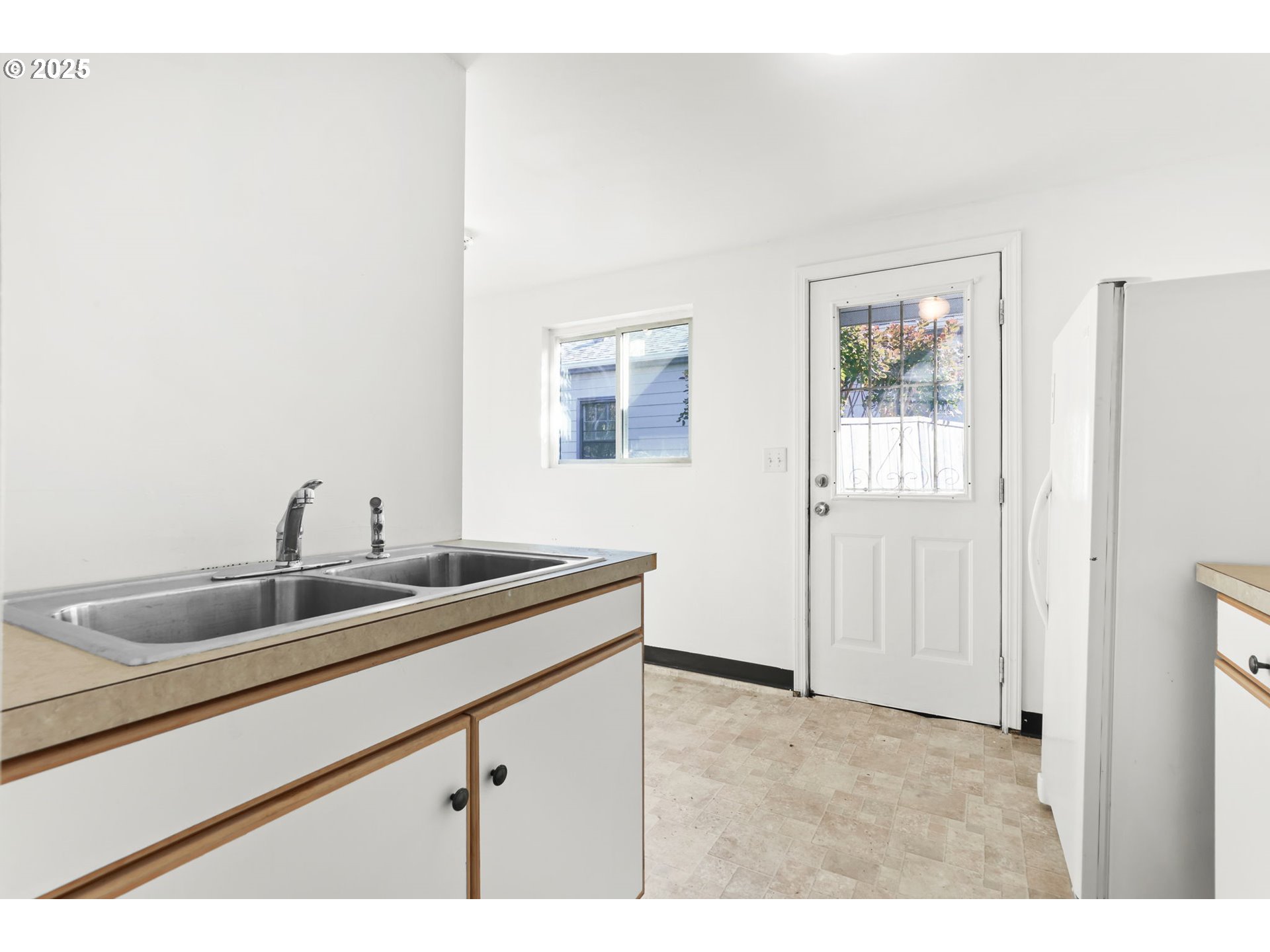 8233 Northeast Tillamook Street Portland, OR 97220 - Photo 37 of 46 a kitchen with a sink and cabinets