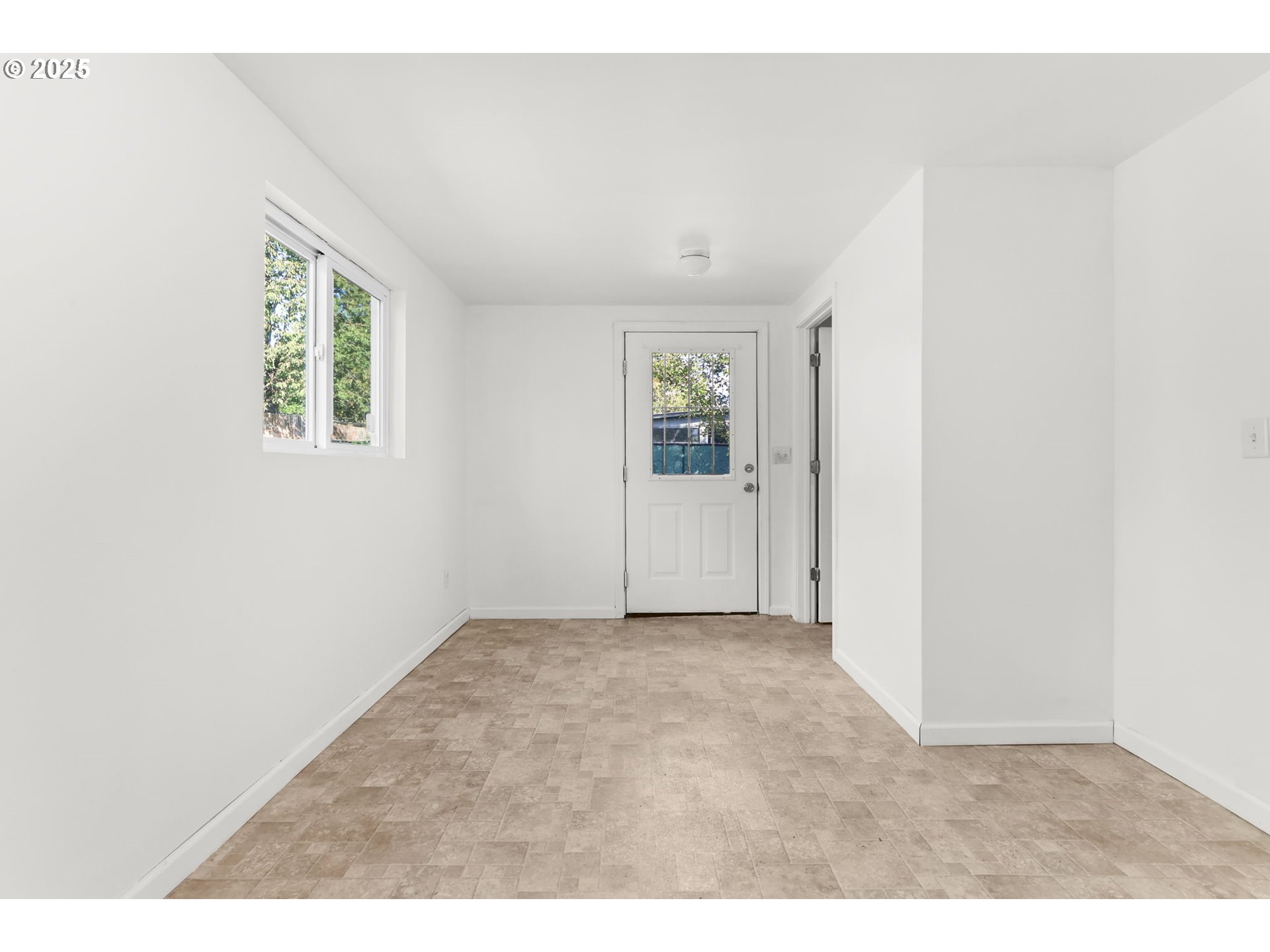 8233 Northeast Tillamook Street Portland, OR 97220 - Photo 39 of 46 an empty room with windows