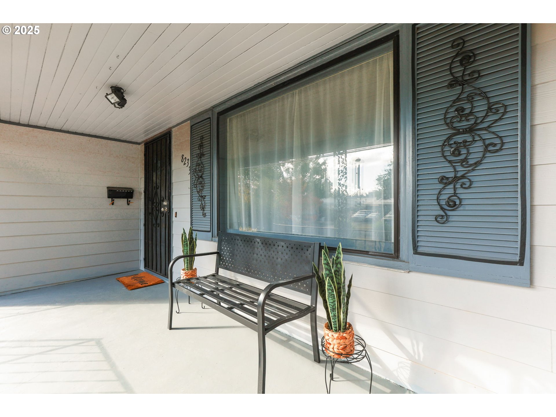 8233 Northeast Tillamook Street Portland, OR 97220 - Photo 7 of 46 a bench is sitting in front of a building