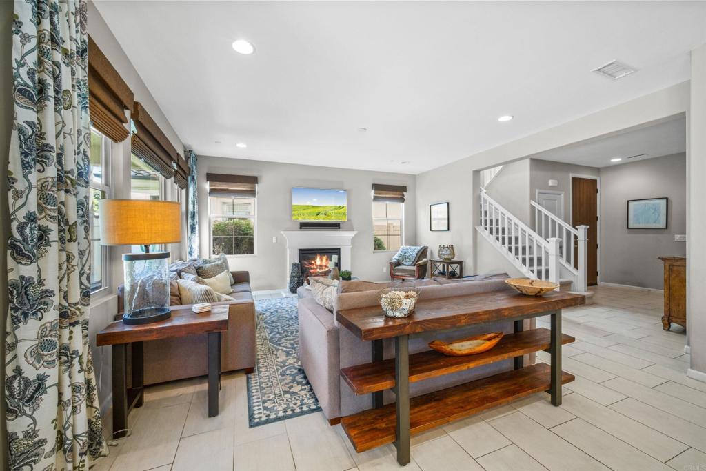 7351 Circulo Ronda Carlsbad, CA 92009 - Photo 15 of 37 a living room with furniture and a wooden floor