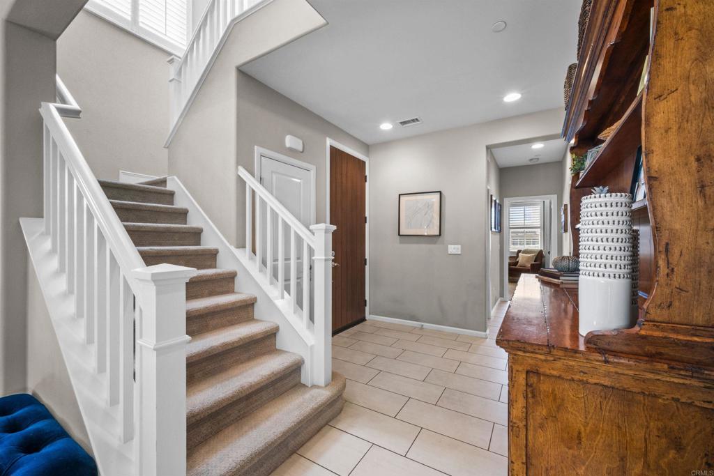 7351 Circulo Ronda Carlsbad, CA 92009 - Photo 18 of 37 a view of entryway and hall with wooden floor