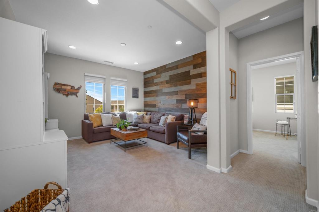7351 Circulo Ronda Carlsbad, CA 92009 - Photo 20 of 37 a living room with furniture and a large window