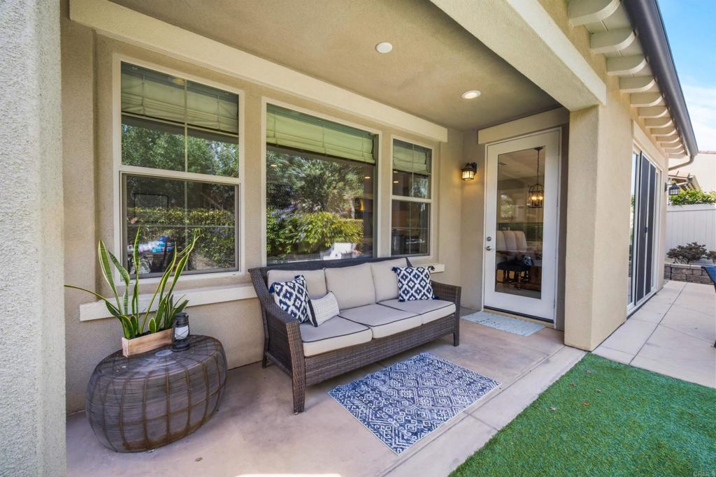 7351 Circulo Ronda Carlsbad, CA 92009 - Photo 29 of 37 a living room with furniture and a rug