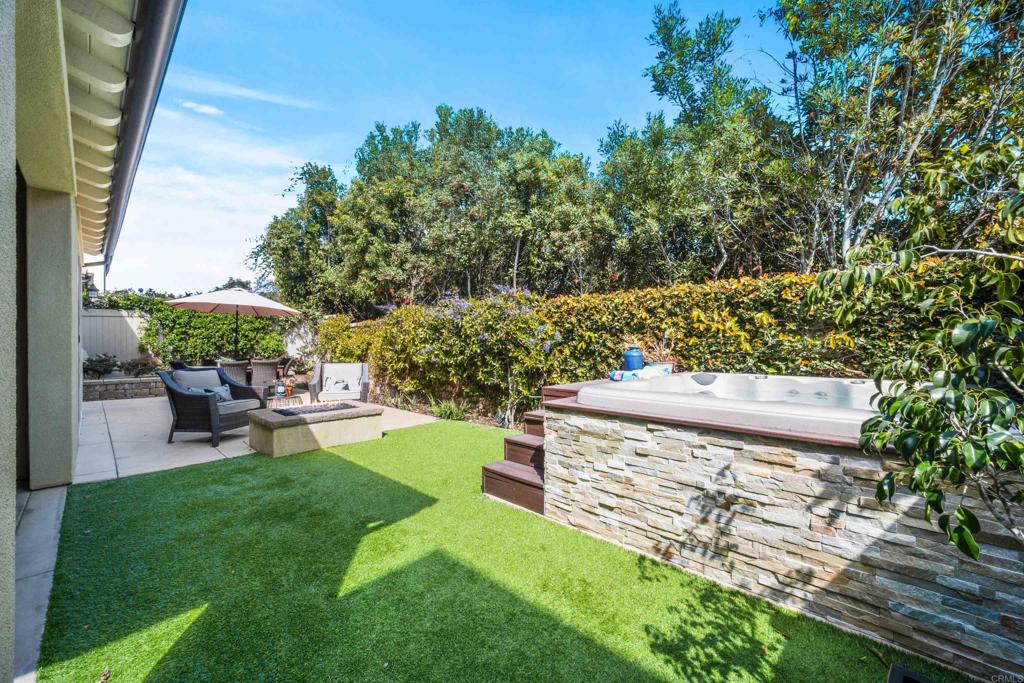 7351 Circulo Ronda Carlsbad, CA 92009 - Photo 30 of 37 a view of a backyard with sitting area