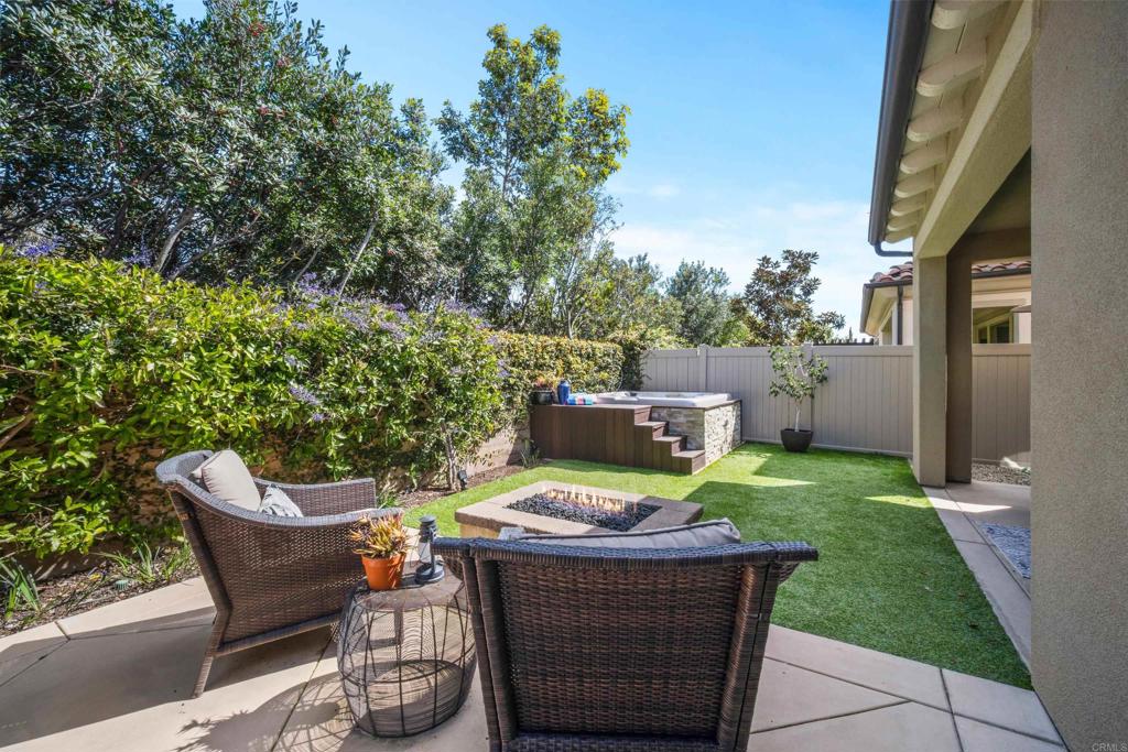7351 Circulo Ronda Carlsbad, CA 92009 - Photo 32 of 37 a view of a chair and table in backyard of the house