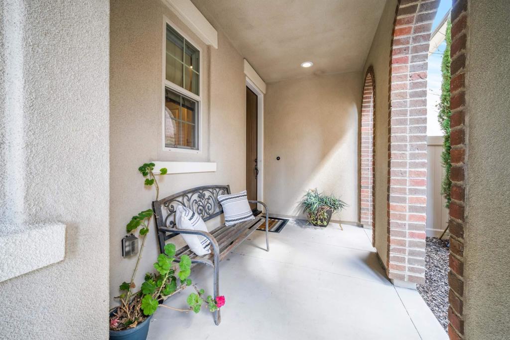 7351 Circulo Ronda Carlsbad, CA 92009 - Photo 4 of 37 a view of an entryway with flower pot