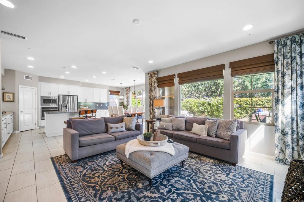 7351 Circulo Ronda Carlsbad, CA 92009 - Photo 7 of 37 a living room with furniture and a large window