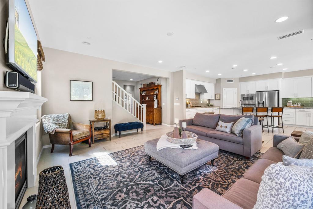 7351 Circulo Ronda Carlsbad, CA 92009 - Photo 8 of 37 a living room with furniture or couch and a flat screen tv