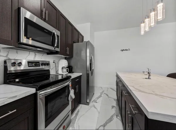 a bathroom with a double vanity sink mirror and shower