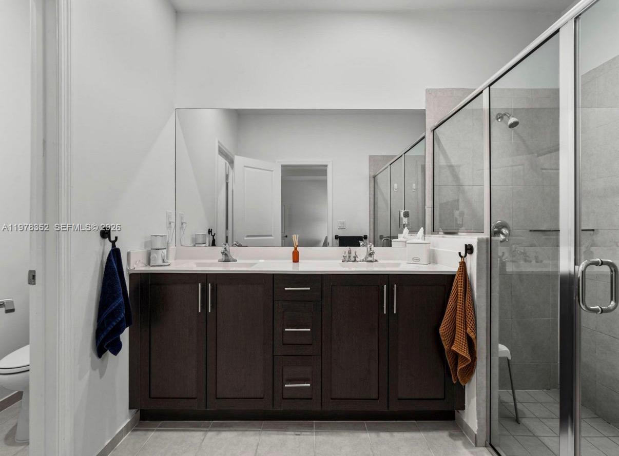 13351 Southwest 190th Street Miami, FL 33177 - Photo 21 of 45 a bathroom with a sink double vanity and a mirror