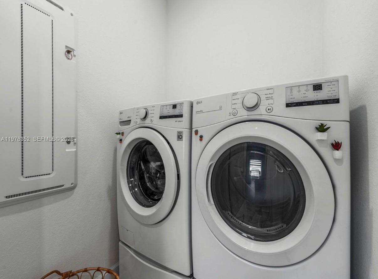 13351 Southwest 190th Street Miami, FL 33177 - Photo 24 of 45 a utility room with dryer and washer