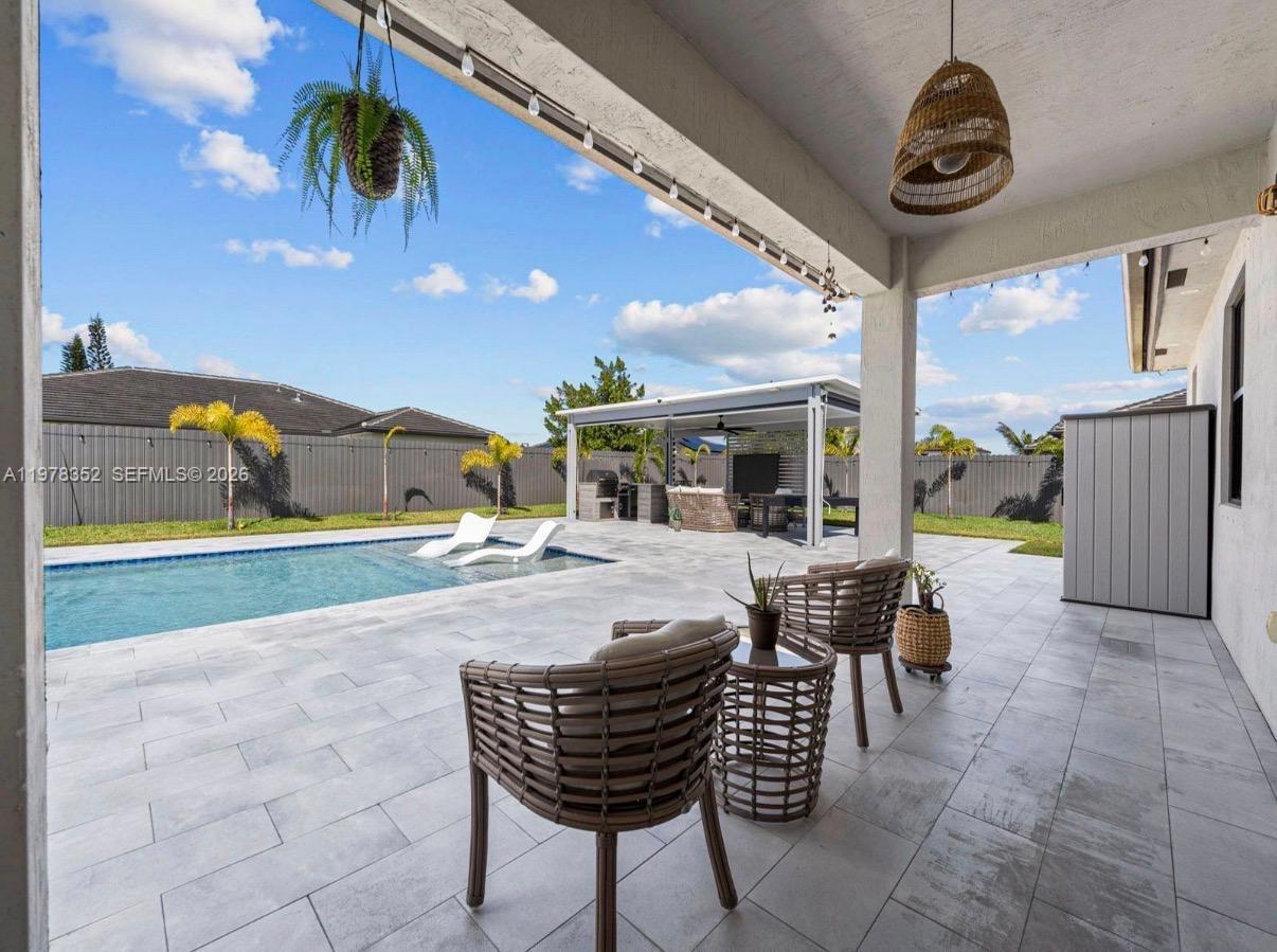 13351 Southwest 190th Street Miami, FL 33177 - Photo 25 of 45 a view of an outdoor space with seating area