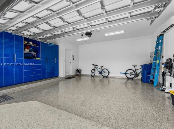 a building outdoor space with patio furniture and potted plants
