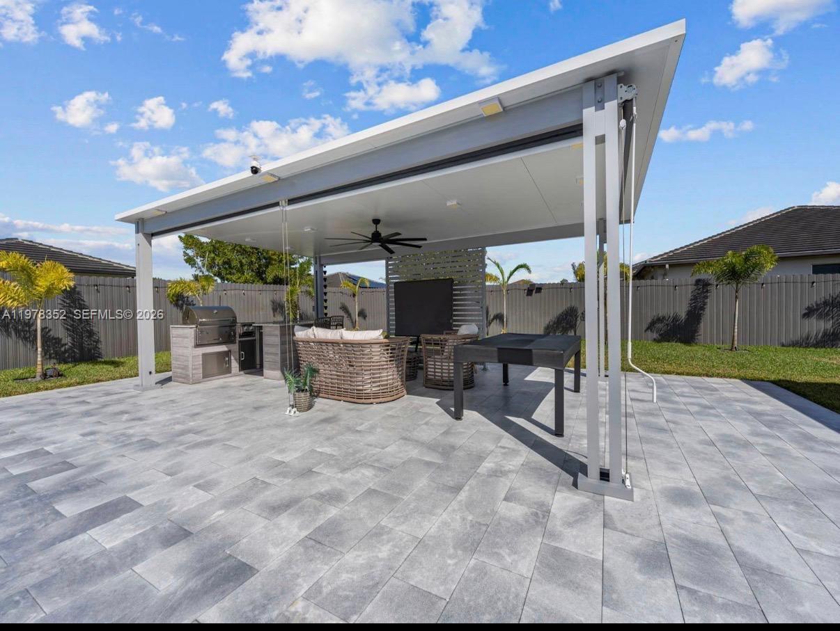13351 Southwest 190th Street Miami, FL 33177 - Photo 31 of 45 a building outdoor space with patio furniture and potted plants