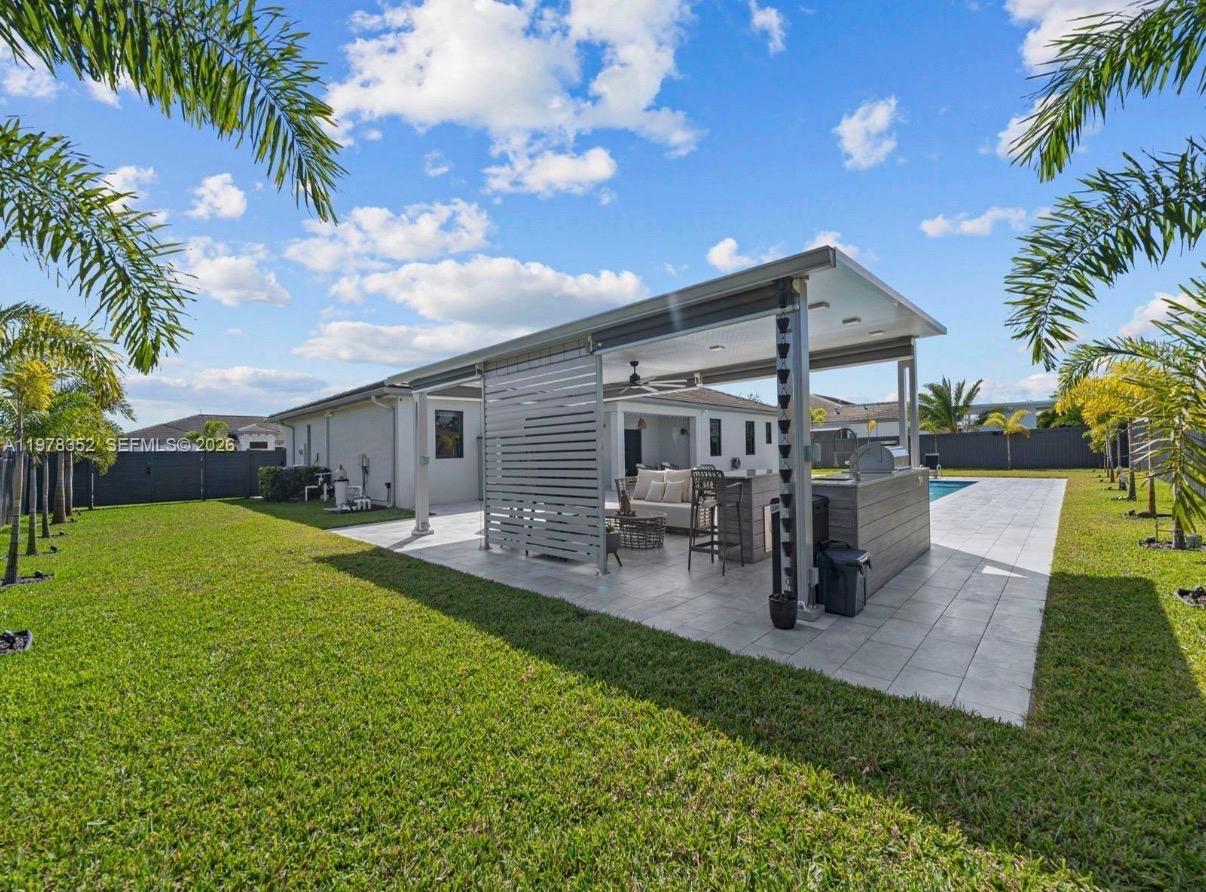 13351 Southwest 190th Street Miami, FL 33177 - Photo 35 of 45 a view of a house with a patio