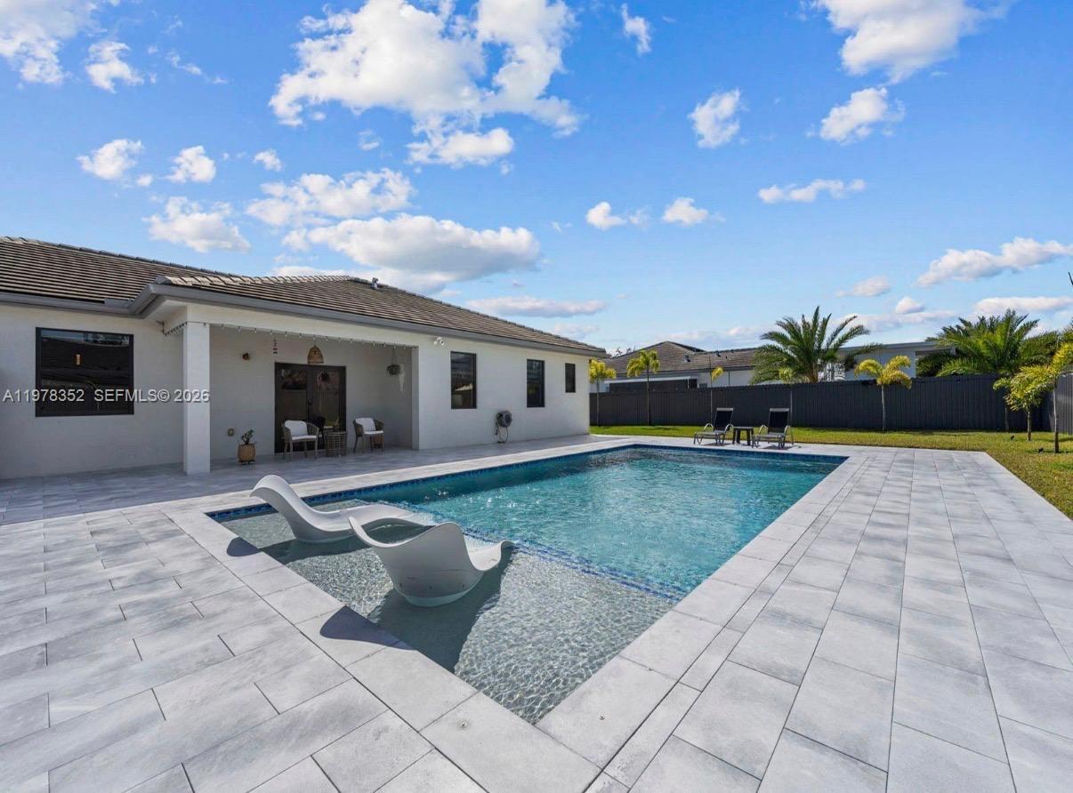 13351 Southwest 190th Street Miami, FL 33177 - Photo 36 of 45 a view of a house with backyard and sitting area