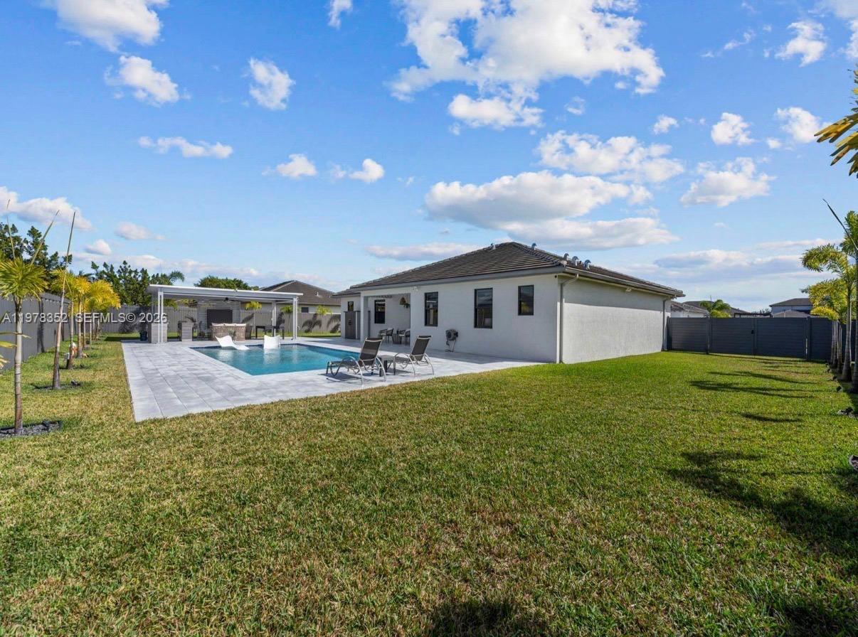 13351 Southwest 190th Street Miami, FL 33177 - Photo 38 of 45 a front view of house with yard and seating