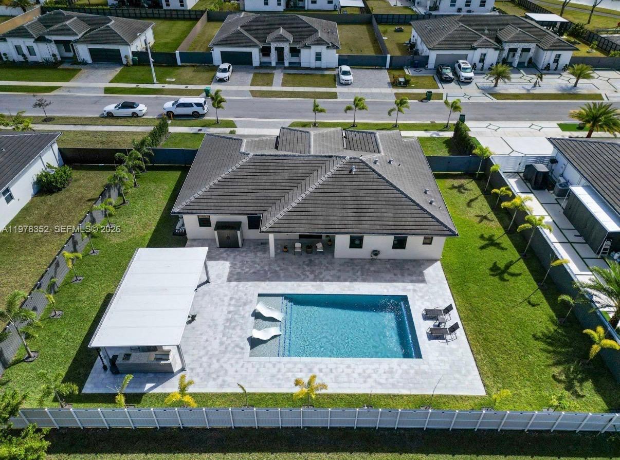 13351 Southwest 190th Street Miami, FL 33177 - Photo 41 of 45 an aerial view of a house with a swimming pool outdoor seating