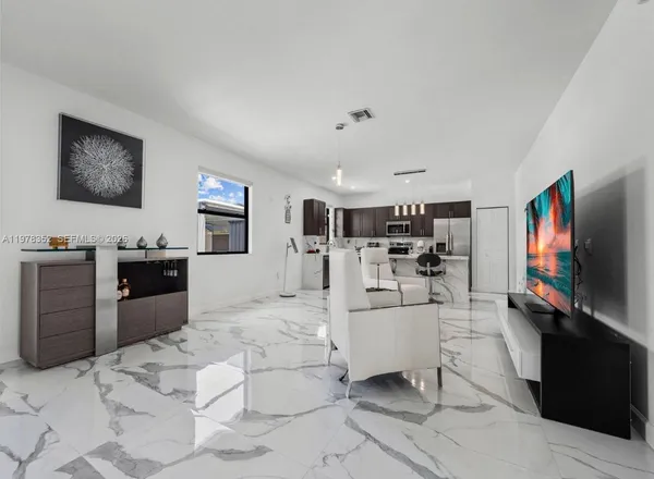 a kitchen with a sink cabinets and window