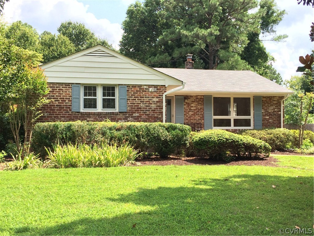 4035 Collingbourne Road Richmond, VA 23235 - Photo 1 of 30 a front view of a house with a yard