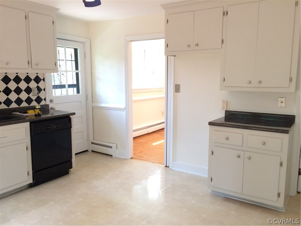 4035 Collingbourne Road Richmond, VA 23235 - Photo 15 of 30 a kitchen with white cabinets and window
